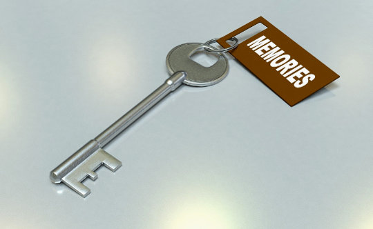 a silver old-style pass key with a tag that says "Memories"