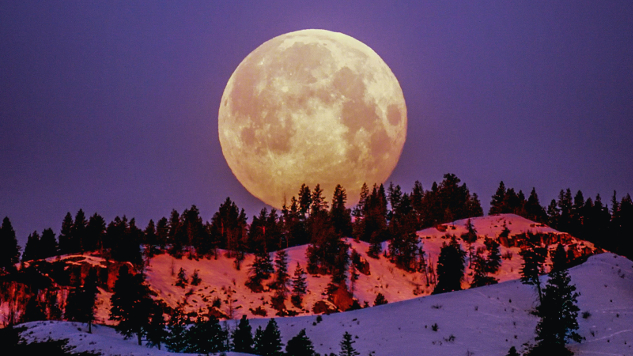 Photo by Frank Cone: Supermoon over snowcapped mountains. 