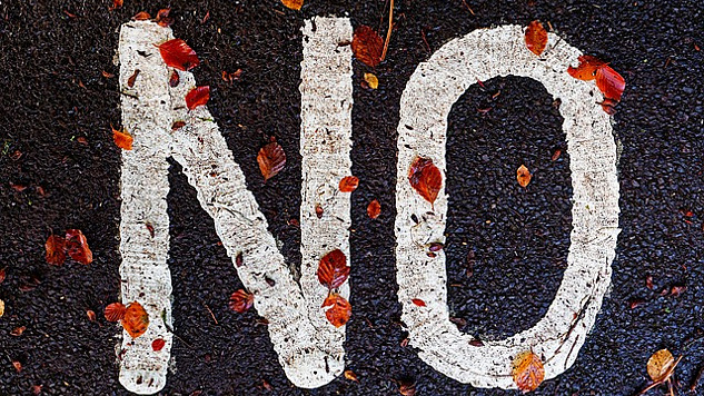 the word "NO" written on the pavement